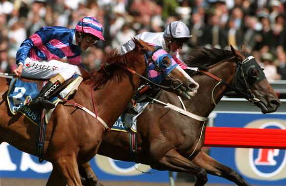 Might and Power, with Jim Cassidy aboard, edges Doriemus in the thrilling 1997 Melbourne Cup.