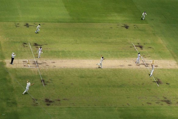 Mitchell Johnson of Australia celebrates taking the wicket of Matt Prior of England during day five of the Third Ashes Test Match.