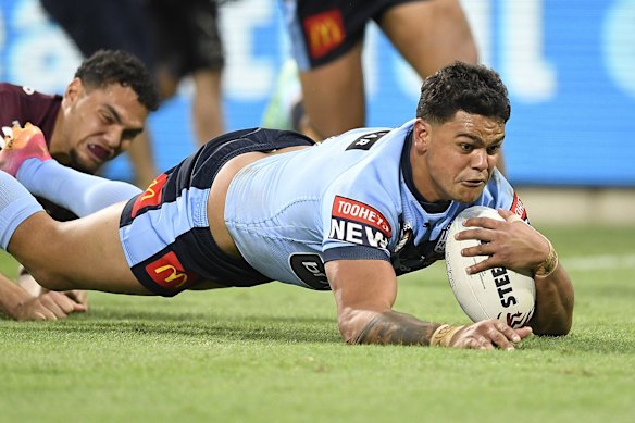 Latrell Mitchell of the Blues scores a try during game one of the 2021 State of Origin series.
