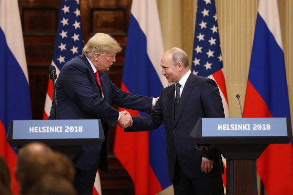 US President Donald Trump shakes hands with Vladimir Putin, Russia's President, during a news conference in Helsinki, Finland, in 2018.
