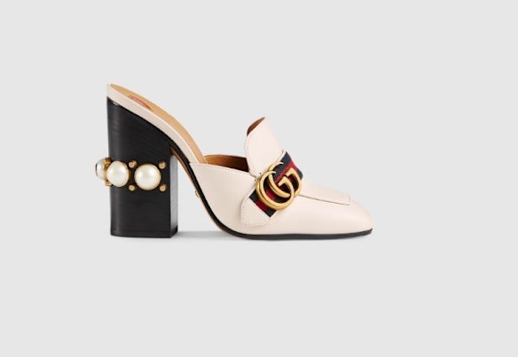 Gucci, leather studded mules, $1205.
