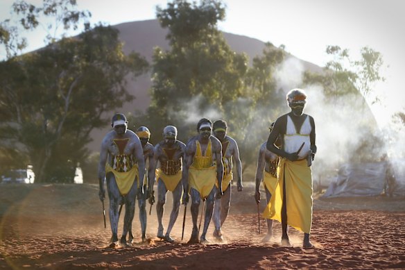 Gumatj clan ceremonial leaders performing the Gurtha ceremony at the opening ceremony of the First Nations National Convention held in Uluru, at the Mutitjulu community.