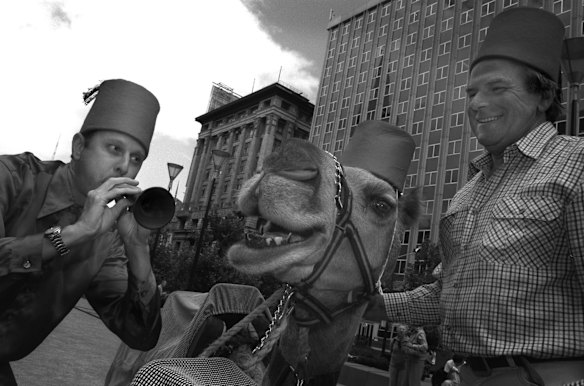 Phil Carroll playing the Zurna as Boris the camel sings on.   Right is the owner of the camel, Kevin Handley from Woodend, 2002.