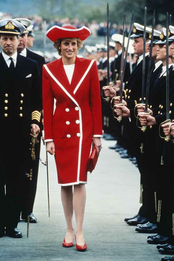 Diana, Princess of Wales, wore a red Catherine Walker dress and Philip Somerville hat to the passing out parade at Dartmouth Royal Naval College, Devon, April 1989. 