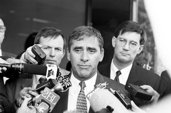 NSW Premier, John Fahey, opens the campaign offices of the Liberal candidate for Manly, David Oldfield. The Premier speaks to the press with Tony Abbott and David Oldfield in the background, 13 July 1994.