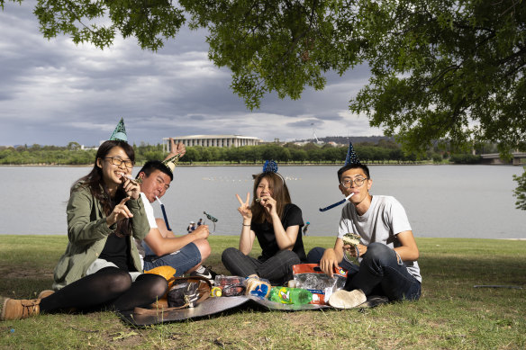 Mona Liu, Yu Li, Lou Liou and Jerry Wu, pictured above at Commonwealth Park, are ready to celebrate New Years Eve