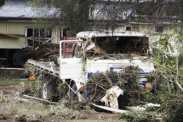 Emergency services search for bodies in the town of Grantham, in the Lockyer Valley, which was devastated by a sudden flood on January 10. Photo: Dean Saffron