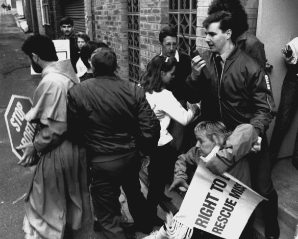 Scuffle: Security guards clash with protesters.