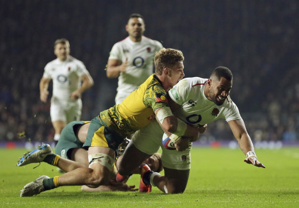 England's Joe Cokanasiga is tackled just short of the line by Australia's Michael Hooper.