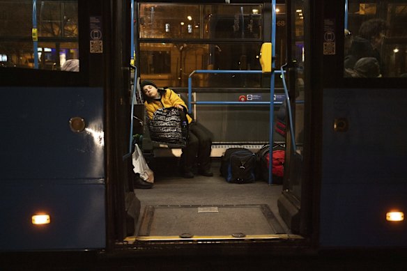 A boy from Ukraine sleeps on a bus after arriving at Keleti station in Budapest, Hungary. The UN refugee agency has said Russia's invasion of Ukraine has sparked Europe's gravest refugee crisis since World War II.