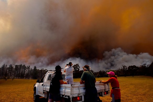 RFS fire fighters in property protection mode on the Klein's property on Wheelbarrow Rd, Colo Heights. 