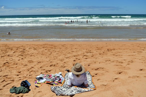Beachgoers at Avalon Beach in Sydney. Northern beaches are preparing for an influx of visitors when lockdown ends.