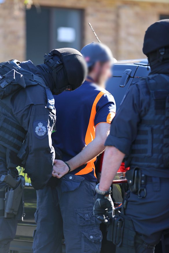 Mehmet Biber being arrested this morning in Birrong on terrorism and foreign incursion charges.