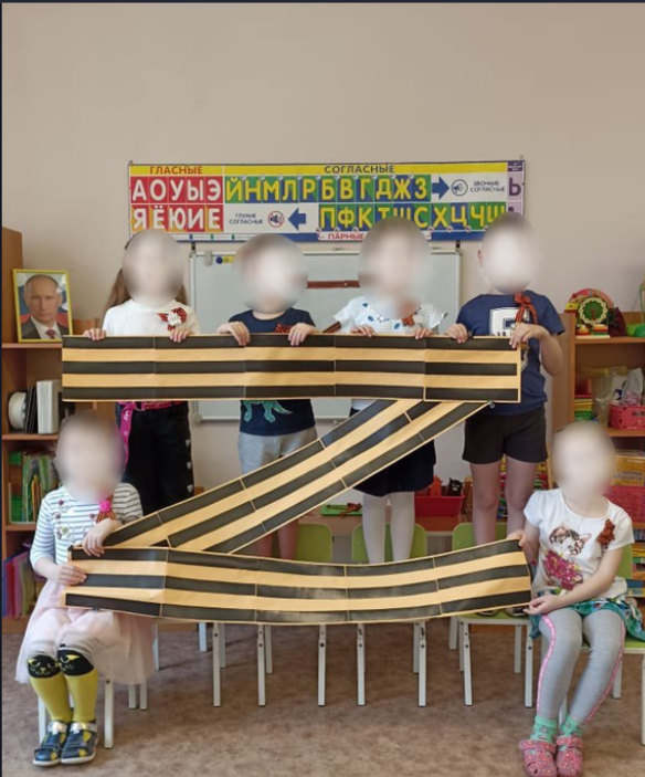 Across Russia, schools are uploading photos of children posing with Z signs to support the troops in Ukraine.