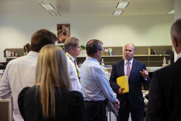 Treasurer Josh Frydenberg goes through the budget with editors and journalists of The Sydney Morning Herald and The Age during the budget lock up at Parliament House.