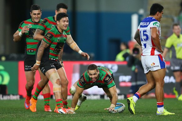 Go goanna: Greg Inglis with his trademark try celebration.