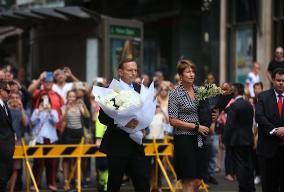 Prime Minister Tony Abbott and partner Margaret arrive at Martin Place, Sydney to lay a bouquet of flowers and pay their respects to those involved in the Lindt Cafe tragedy.