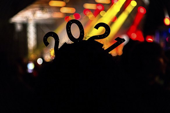 Katrina Mohi watches bands in Hagley Park in Christchurch, New Zealand during New Year celebrations.
