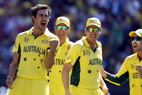 Australia's Mitchell Starc (L) celebrates with team mates after bowling New Zealand's captain Brendon McCullum for a duck during their Cricket World Cup final match at the Melbourne Cricket Ground (MCG) March 29, 2015.      
