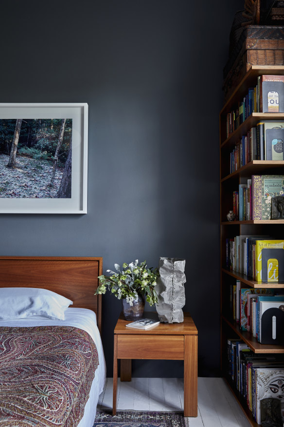 The bed from Planet features a hand-embroidered antique cover from India. The photograph is by Rosemary Laing and the mesh lamp is by Astrid Huwald.