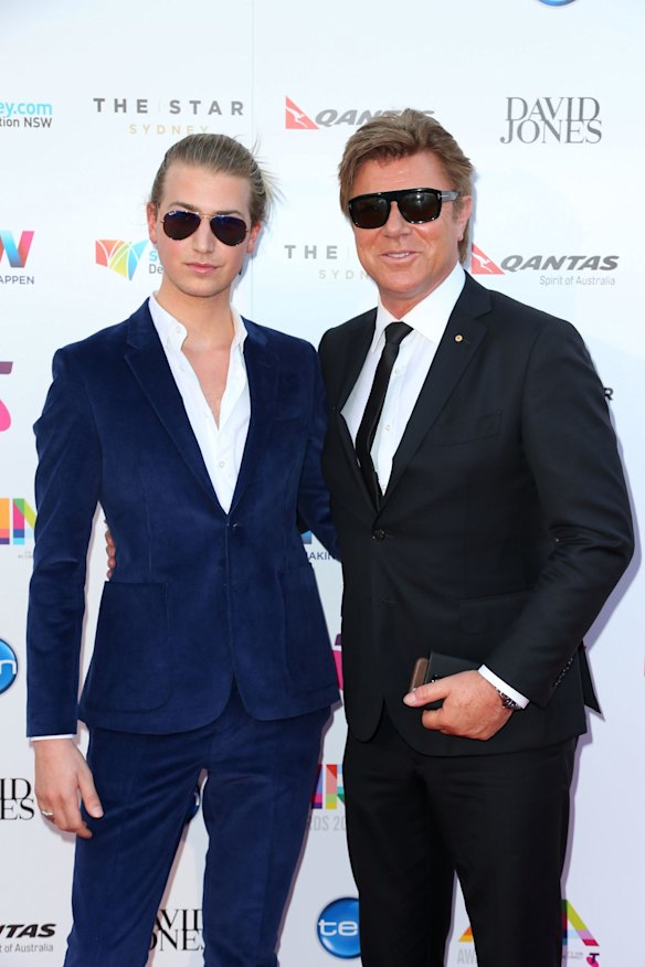 Richard Wilkins and Christian Wilkins walk the carpet.