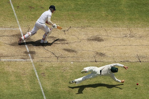 Ben Stokes of England watches as Steve Smith of Australia dives for a catch during day five of the Third Ashes Test Match.