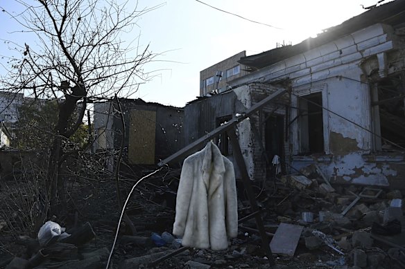A white coat rescued from the ruins hangs on debris in front of residential homes damaged by a missile attack on November 1 in Mykolaiv, Ukraine. 