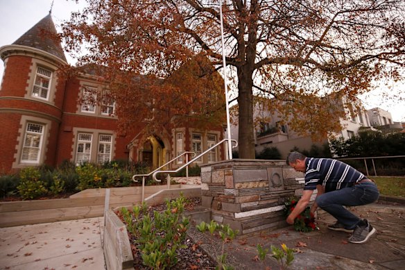 A man lays a wreath outside the Kew R.S.L. Club on April 25, 2020 in Melbourne, Australia. 