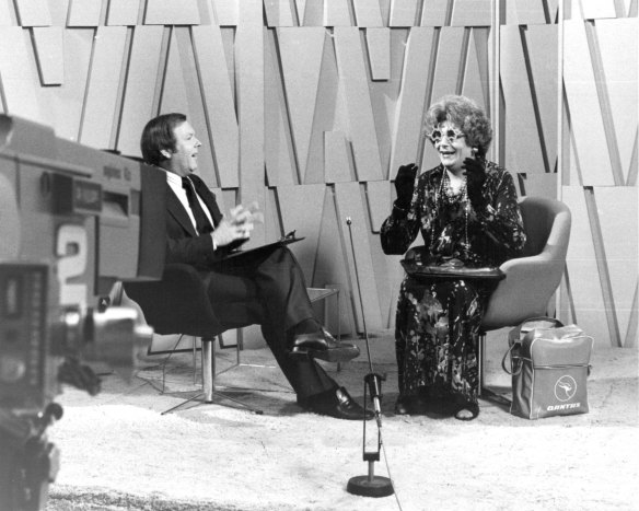 Noon ticks around, and it’s on with the show... Mike Walsh interviews Dame Edna Everage at the Channel Nine studios, Willoughby, on May 2, 1978.