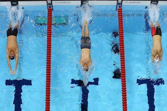 Ryan Lochte (left) of the United States, Tyler Clary of the United States (centre) and Fenglin Zhang of China (right) compete in the men's 200m backstroke final.