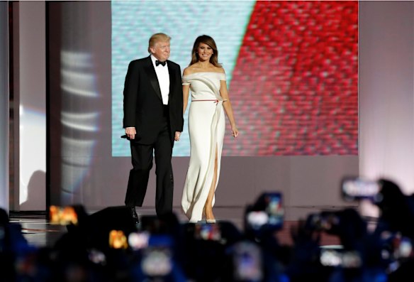 President Donald Trump, left, arrives with first lady Melania Trump at the Liberty Ball, an event she confused for an O Week toga party.