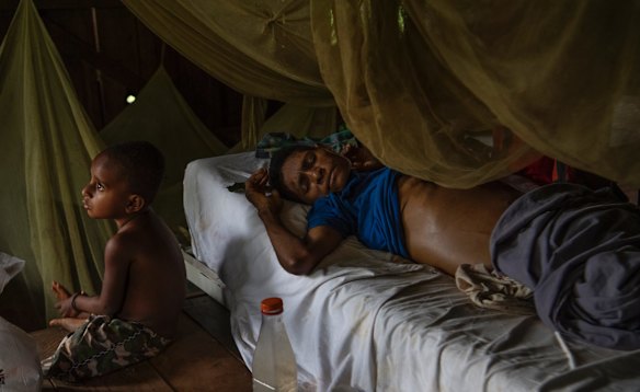 Sabodame Sebado who suffers from an untreatable liver condition is pictured here with her son at the  Mougulu health centre.