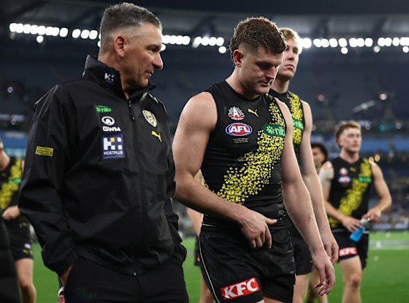 Adem Yze and Jacob Hopper leave the ground at the MCG on Friday night.