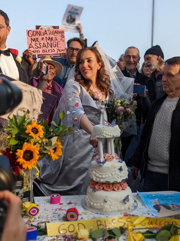 Stella Moris cuts her wedding cake outside Belmarsh Prison on Wednesday March 23, 2022 after marrying Australian detainee and WikiLeaks founder Julian Assange who is fighting his extradition to the United States to face spying charges.