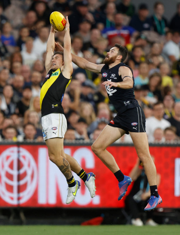 Liam Barker takes a mark in front of Mitch McGovern.