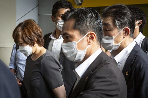 Akie Abe (at left), wife of former Japanese prime minister Shinzo Abe arrives at Yamato-yagi station to visit Nara Medical University Hospital where Shinzo Abe was transferred. 