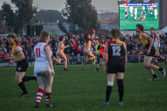 Streakers run on to the ground during the Reclink Community Cup.