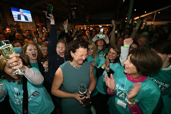 "Teal" independent Monique Ryan celebrates at the Auburn Hotel in Melbourne. Treasurer Josh Frydenberg is projected to lose the prized Liberal seat of Kooyong.