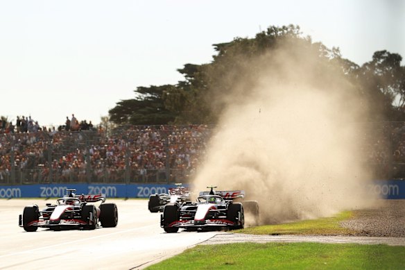 Mick Schumacher of Germany driving the (47) Haas F1 VF-22 Ferrari runs wide next to Kevin Magnussen of Denmark.
