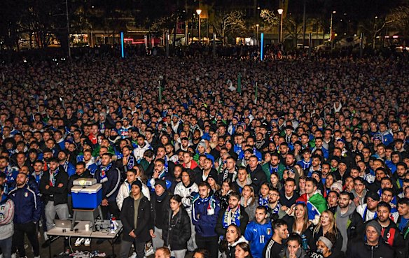 Thousands of Italian soccer fans fill Piazza Italia in Lygon Street, Carlton, in the early hours of the morning to watch the Euro 2020 final between England and Italy being played at Wembley Stadium in London.
