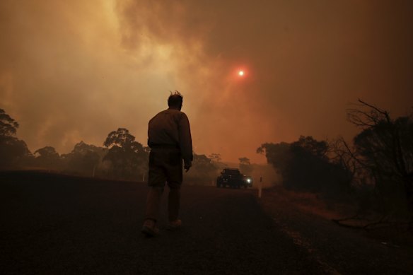Chris Collins evacuates as the North Black Range bushfire threatens properties at Bombay.
