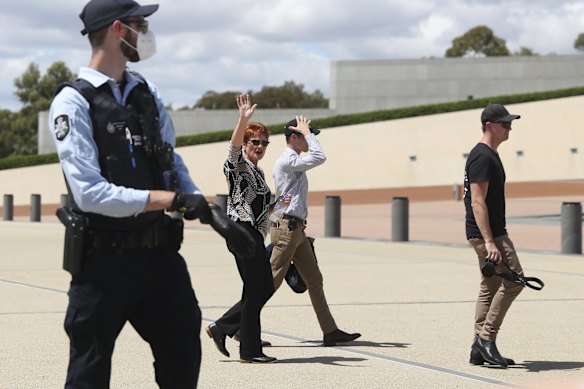 Senator Pauline Hanson is seen on the forecourt of Parliament House, as 'Convoy to Canberra' protesters gather on the front lawn, in Canberra.