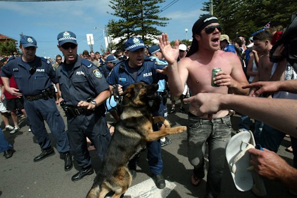 Police used dogs on the angry crowd as they shouted racial taunts.