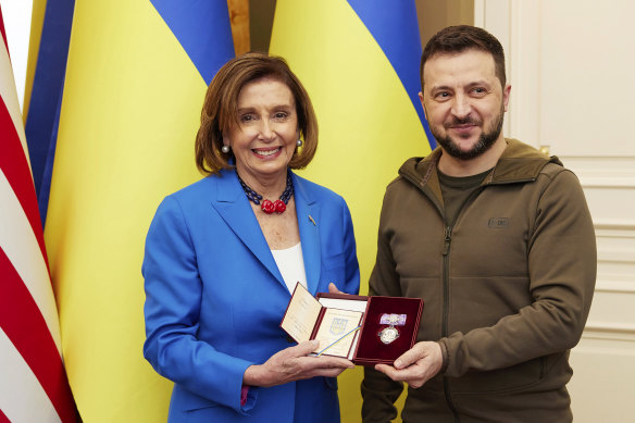 Ukrainian President Volodymyr Zelensky awards the Order of Princess Olga, the third grade, to US Speaker of the House Nancy Pelosi.