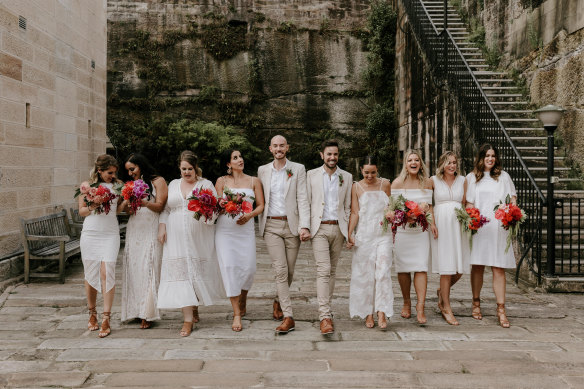 Lawyers Mark Giunta and Michael Codey with their "groomsmaids" on their wedding day in Sydney.