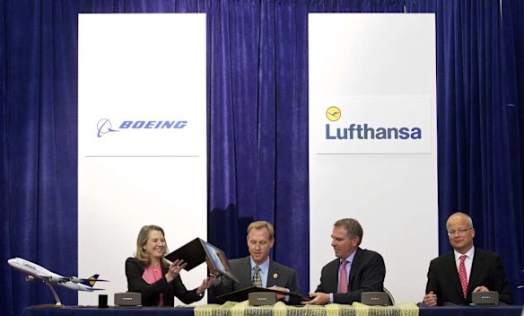From left, Boeing 747 Program Vice President and General Manager Elizabeth Lund, Boeing Commercial Airplanes Senior Vice President Pat Shanahan, Deutsche Lufthansa AG CEO Carsten Spohr and Lufthansa Executive Vice President Nico Buchholz take part signing ceremony for Boeing the 747-8 Intercontinental.