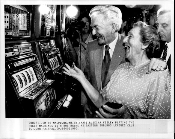 Ruseina Vesley playing the poker machines with Bob Hawke at Eastern Suburbs Leagues Club in February 1990.
