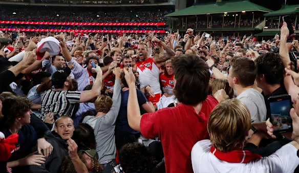 Fans celebrate with Lance Franklin.