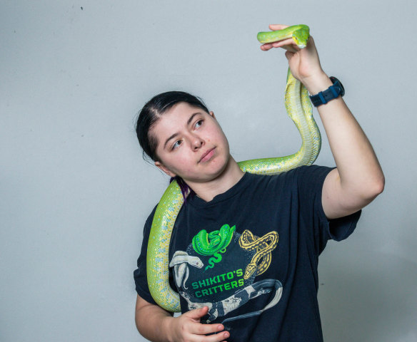 Elizabeth Randall with Flare the green tree python.