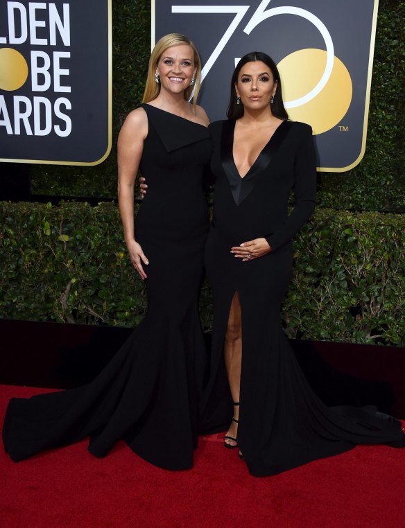 Time's Up leads Reese Witherspoon, left, and Eva Longoria arrive at the 75th annual Golden Globe Awards.